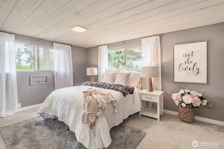 The upper level has two large bedrooms and a full bath! Bedroom #1 has a unique shiplap ceiling.