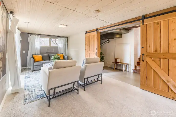 Flow through the pantry/laundry space barn doors to the great room downstairs...