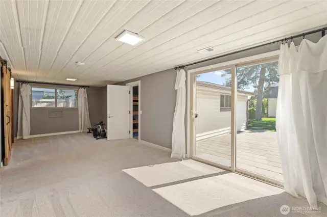 Opposite the bathroom is the large Primary Bedroom. The large slider opens to a gorgeous patio!