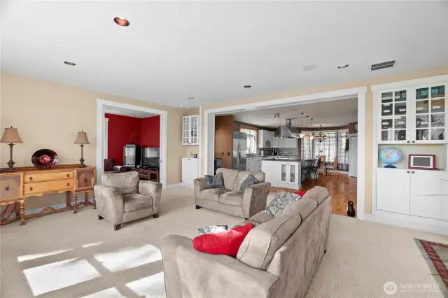 Livingroom with built-ins adjacent to the bonus room and kitchen.