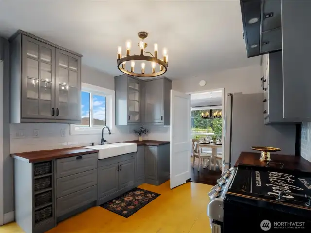 Beautiful chandelier and farmhouse sink