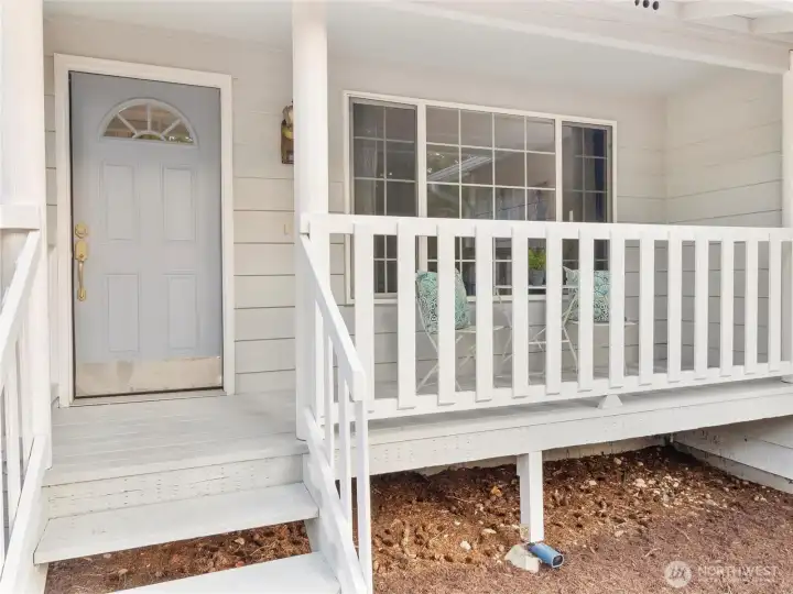 Covered front porch for quiet rainy days.