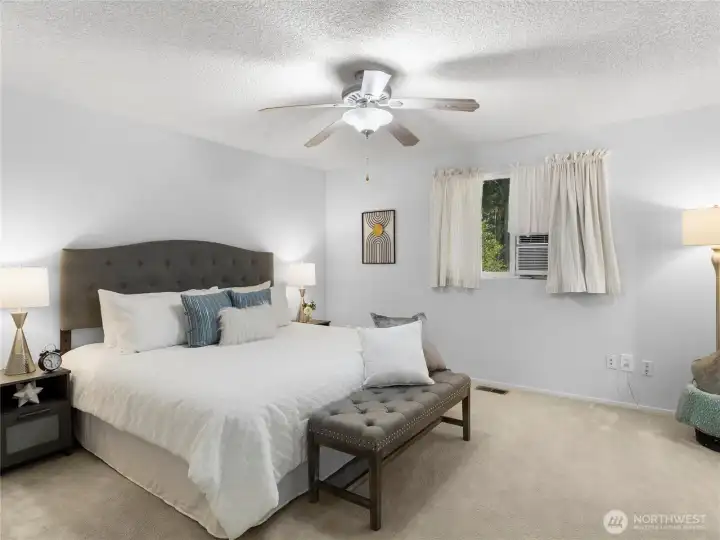 Primary bed and bath with ac unit.