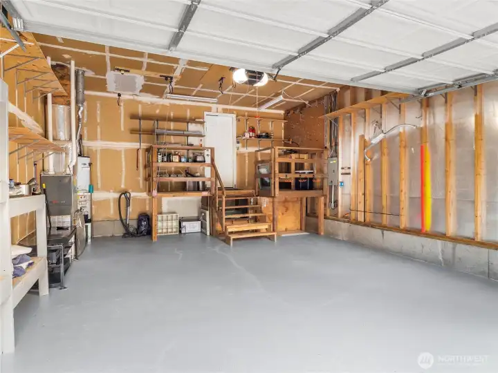 Large multi-vehicle garage with high ceilings.