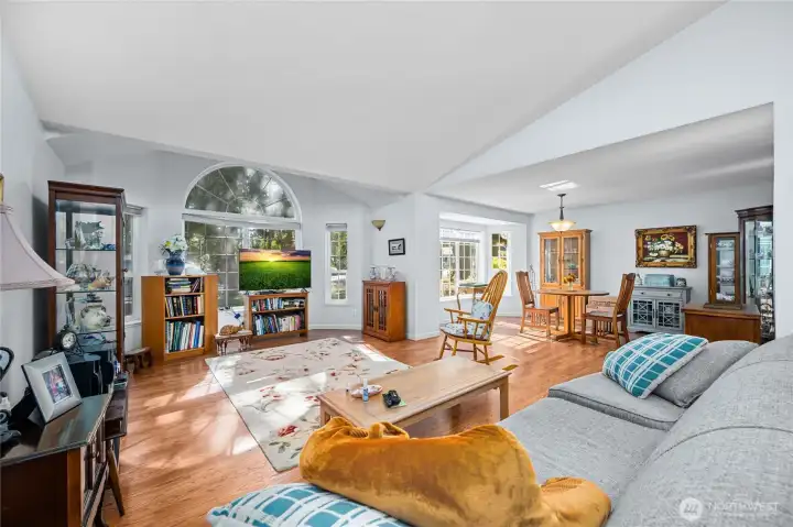 Spacious living and dining area with soaring vaulted ceilings — perfect for entertaining or relaxing in style.