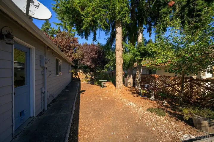 Easy outdoor access from garage to side yard.