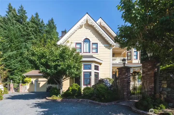Victorian style home showing the 2 car attached garage