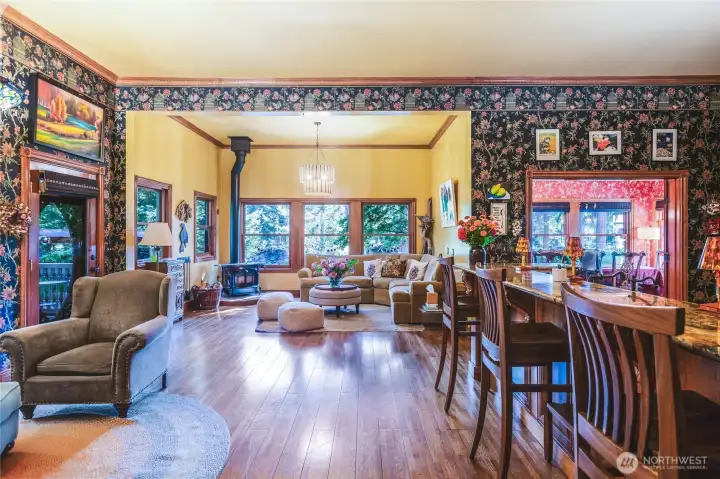 Great room with wood stove and entry to deck