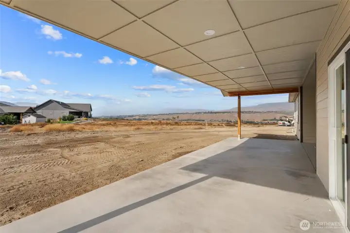 Sit and soak it all in on expansive covered patio