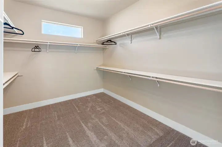 Wardrobe closet off of primary bathroom