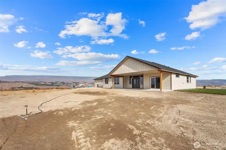 Perched on corner lot- views all around- and room for a pool and a shop if desired!