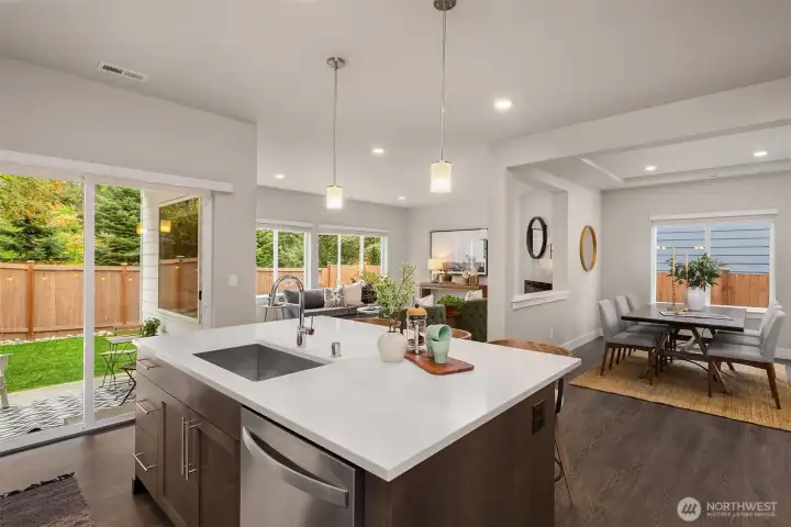 Flooded with natural light, the main floor features a thoughtful, well-designed layout - with privacy and serene views of greenery.