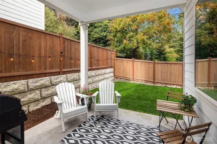 Covered patio with soaring ceilings lets you enjoy the outdoors year-round.
