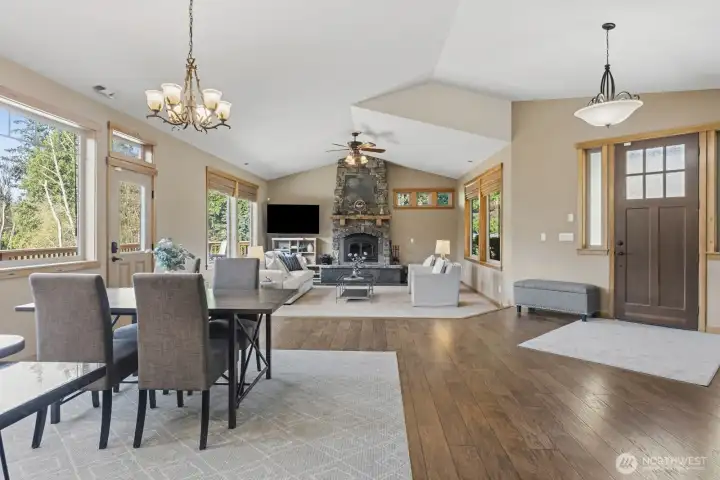 Open concept floor plan designed for seamless flow between Living room, Dining room and Kitchen. Perfect for entertaining. The door leads you to the expansive Wrap-around Deck.