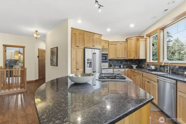 Chefs kitchen with Stone countertops, Custom Hickory Cabinets, Stainless Steel appliances, cook with amazing views.
