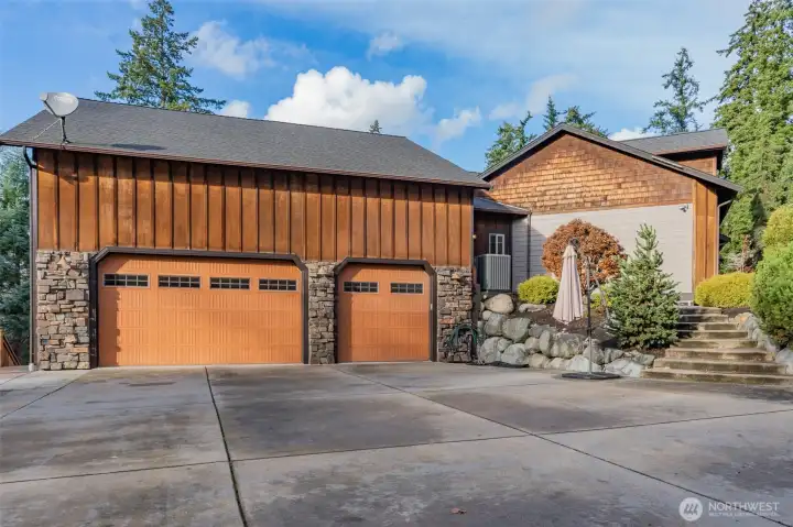 3 car attached garage, with second level storage.