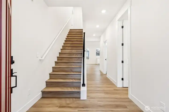 8 entry door with sidelight.  Extended upgraded Luxury Vinal planked flooring on main, stairwell and upper hallway.