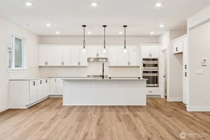 Upgraded cabinets, black hardware and upgrade spring faucet and hanging pendant lighting.