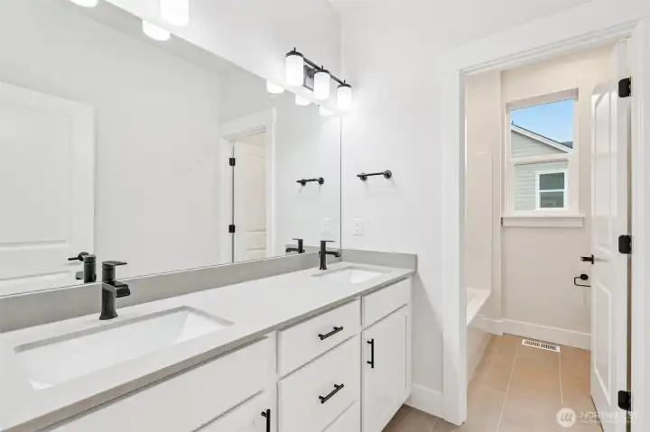 main bath upstairs.  Tib/shower & toilet area are seperate form the long dual sink countertop