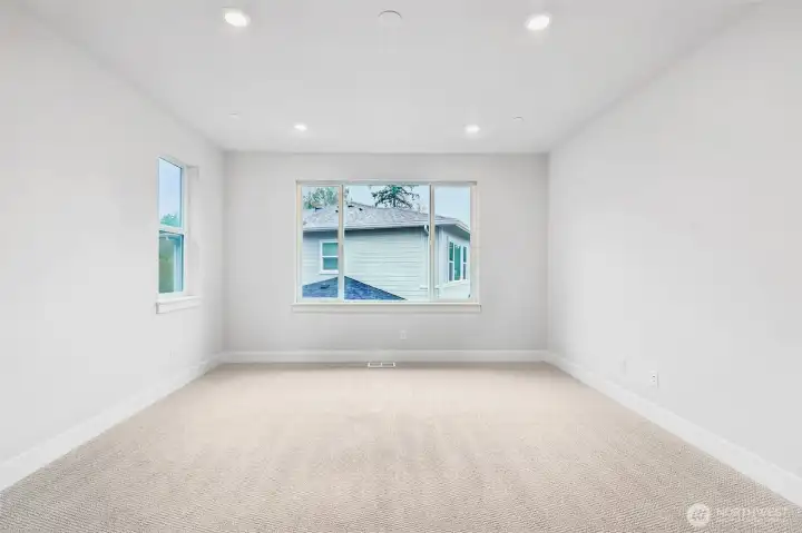 Primary bedroom offers plenty of space for oversized furniture and even room for added chairs or chaise for those quiet moments to read or reflect.