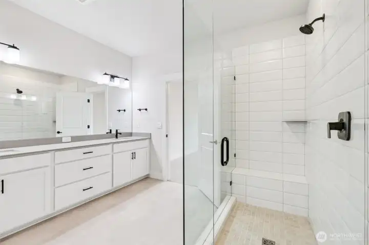 Frameless galss shower and tiled basin