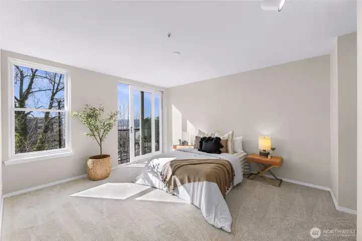 Large primary suite also with slider to the view