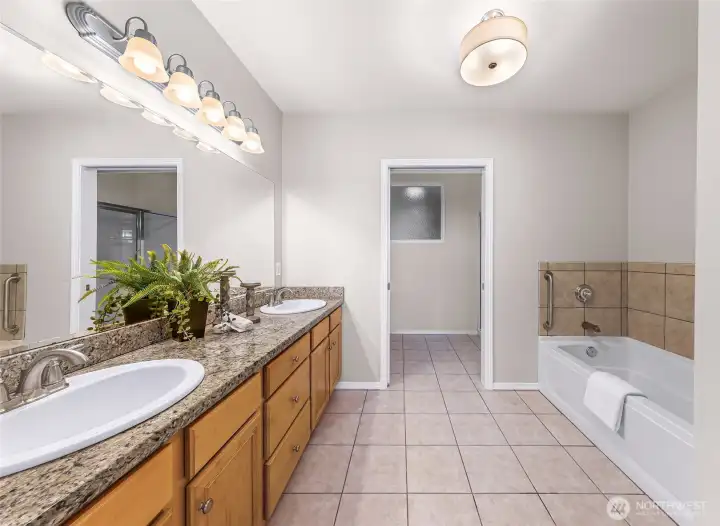 Deep tiled primary bath w/ double sinks