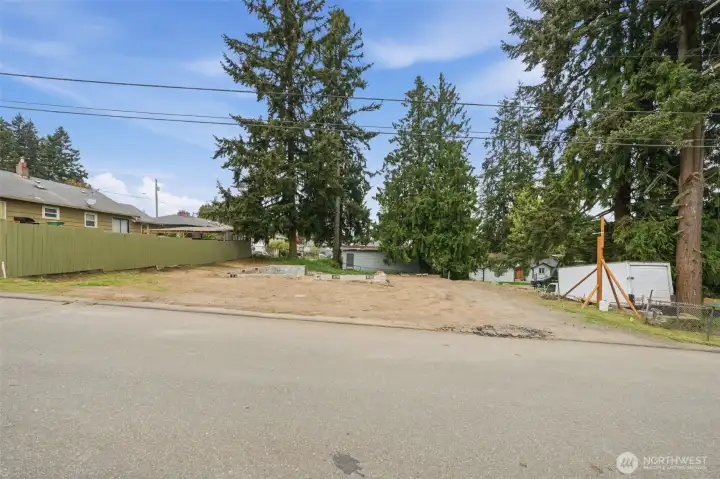Prime cleared lot with gentle slope and strong street presence—ideal for cottage or multi-unit development. Utilities nearby and site prep already underway to accelerate your build timeline.