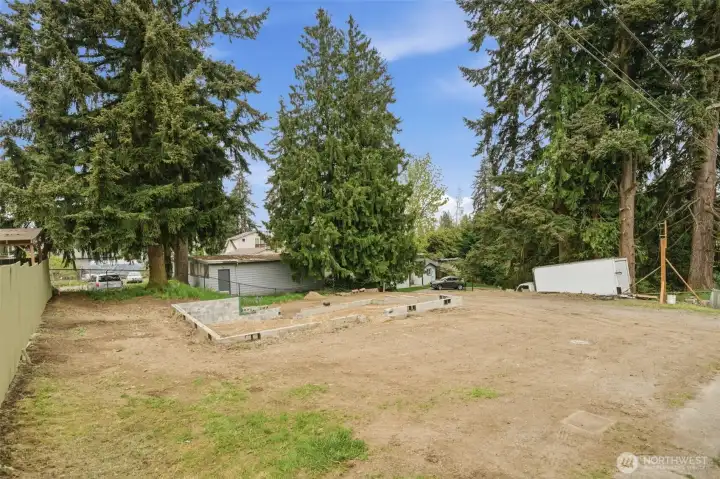 Previous foundation offers a jumpstart for your next project or redesigned build concept. Spacious layout with room to maximize UR4 zoning potential for multiple units or cottages.