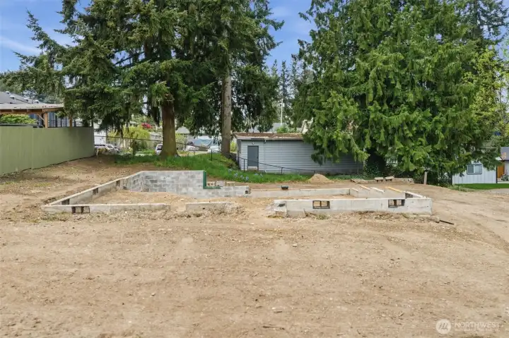 Remnants of previous structure following demolition—site is cleared and ready for redevelopment. Blank slate for builders to design and build new under UR4 zoning.