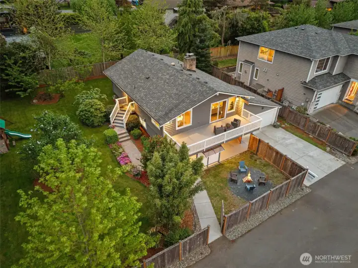 Front exterior of home on a large private  cul-de-sac lot, featuring attached 2-car  garage, expansive driveway, and elevated  setting with territorial views.