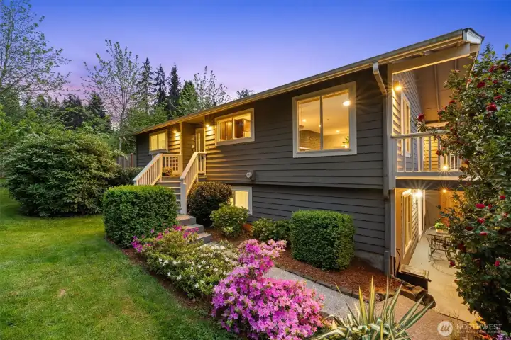 Beautifully updated home in Kenmore,  showcasing mature landscaping, fresh  exterior appeal, and a quiet residential  setting.