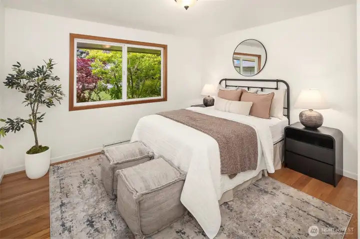A large primary room, big enough for a king bed