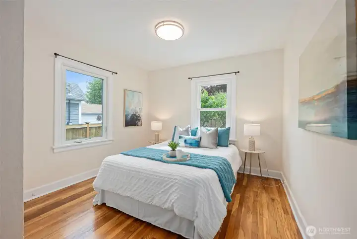 Main level bedroom (Primary) with hardwood floor