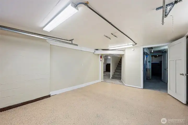 View from the garage door. Right side door is to utility room and a shop, left side door is to bathroom and bedroom