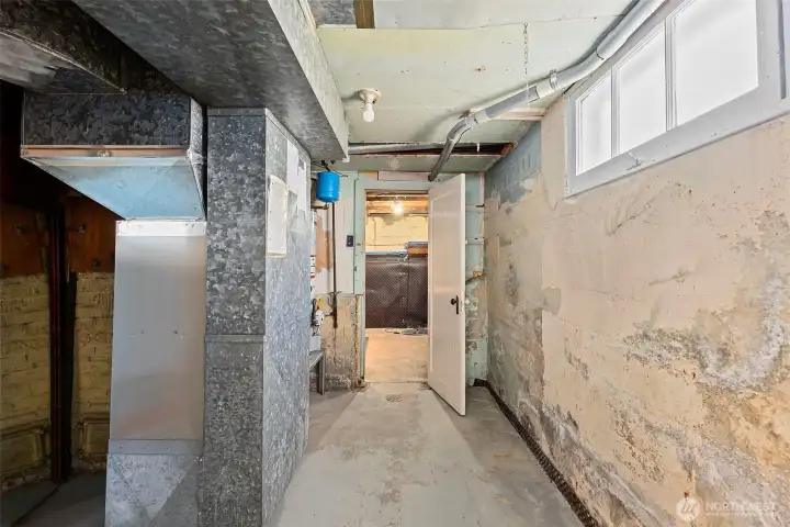 Utility room Furnace and water heater door to the shop