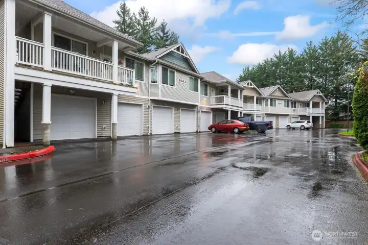 Generous garage with additional open parking.