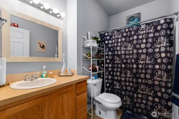 deally situated for guest accessibility, this full bathroom features a convenient location off the main open-concept living area