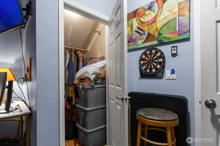 Deep additional storage under the stairs in the garage.