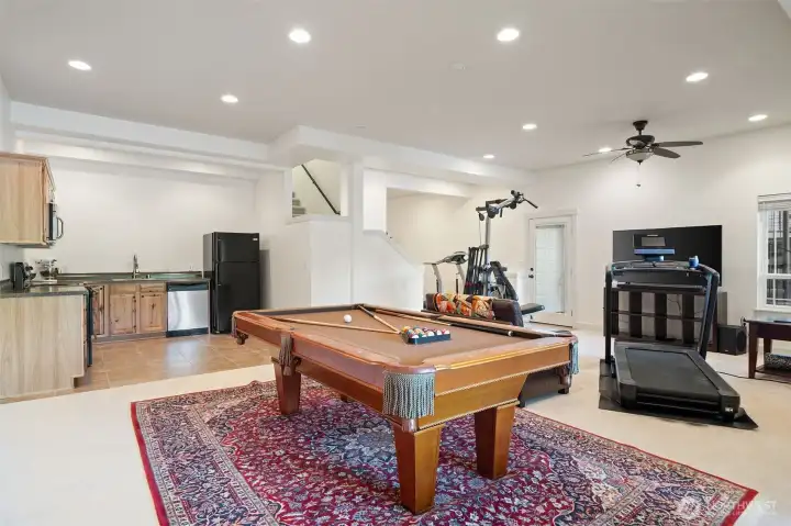 This lower-level space is amazing! You have your own walk-out to the lake!