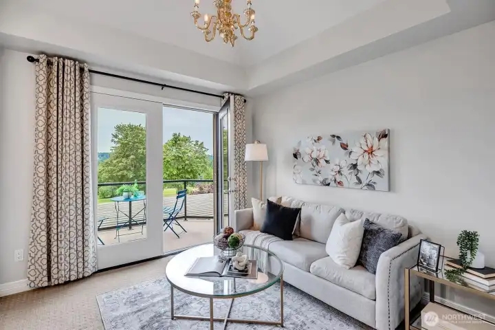 Sitting area in primary. French doors lead to private patio Sitting area in primary. French doors lead to private patio