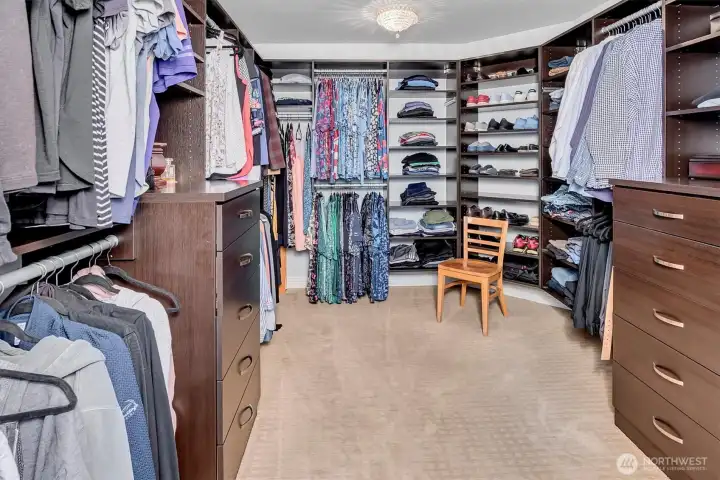 Huge primary closet with built in's galore Huge primary closet with built in's galore