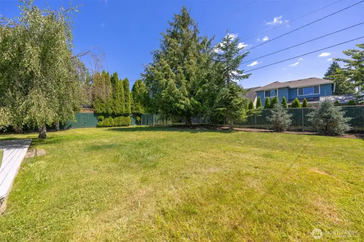 This spacious yard is easy care with a basically blank canvas to be used as you wish.