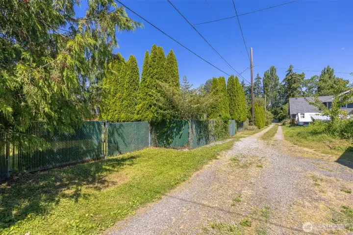 Back yard is fully fenced with a large gate to enter off the alley.