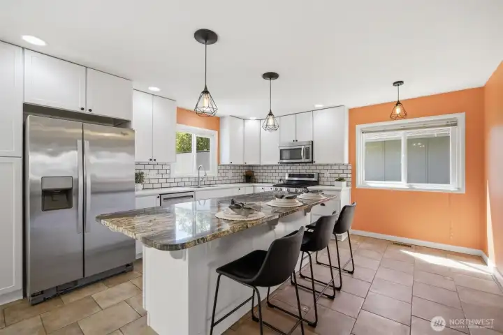 The kitchen has a great flow making it able to have several cooks in the kitchen. The large island offers so much flexibility for whatever use you needs at the time: entertaining, organizing, crafting, morning coffee....