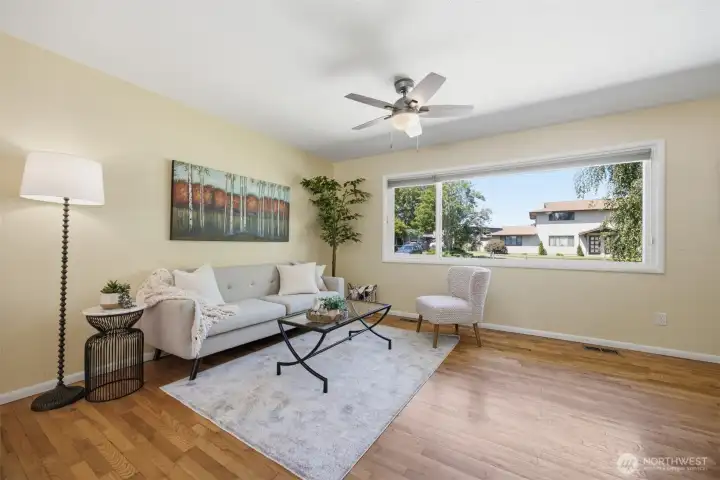 Nice bright windows and great up down shade add to the comfort of this open area living room.