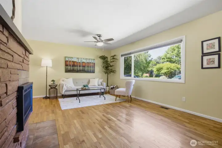 Central fireplace sits nicely between living room and dining room.