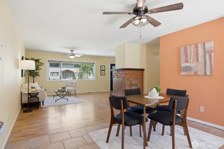 From the back of the house looking to the front. There is a large set of windows that look out to the back yard as well as a sliding door.