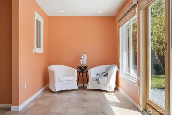 Lovely nook off the kitchen offers a great reading area or informal office space.  Large windows with great treatments bring in wonderful natural light.