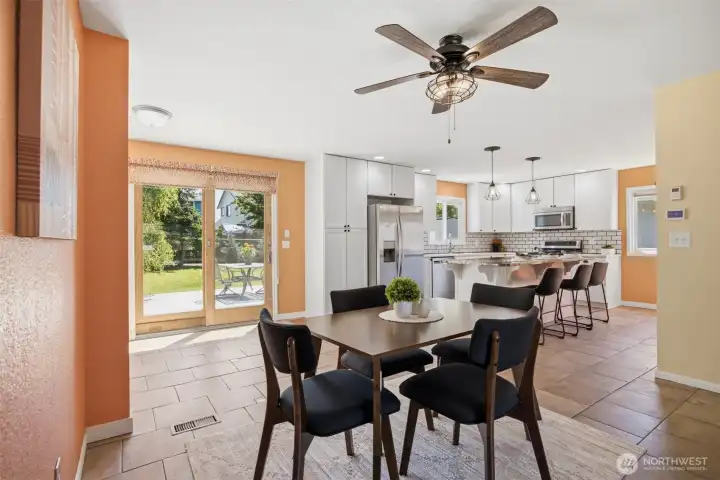 From the main hallway this view shows the sliding door leading to the deck and back yard.  Imagine how great to be grilling outside with the kitchen just steps away.